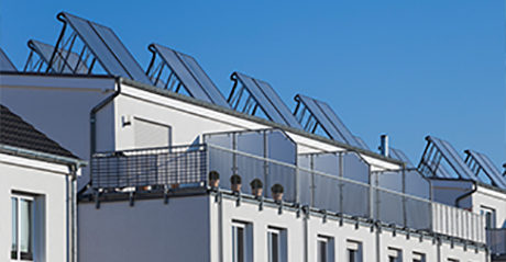 Solar panels on a rooftop viewed from the street