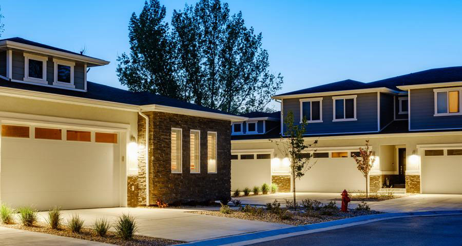 Exterior view of homes in a neighborhood at sunset