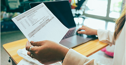 Woman holding a paper statement