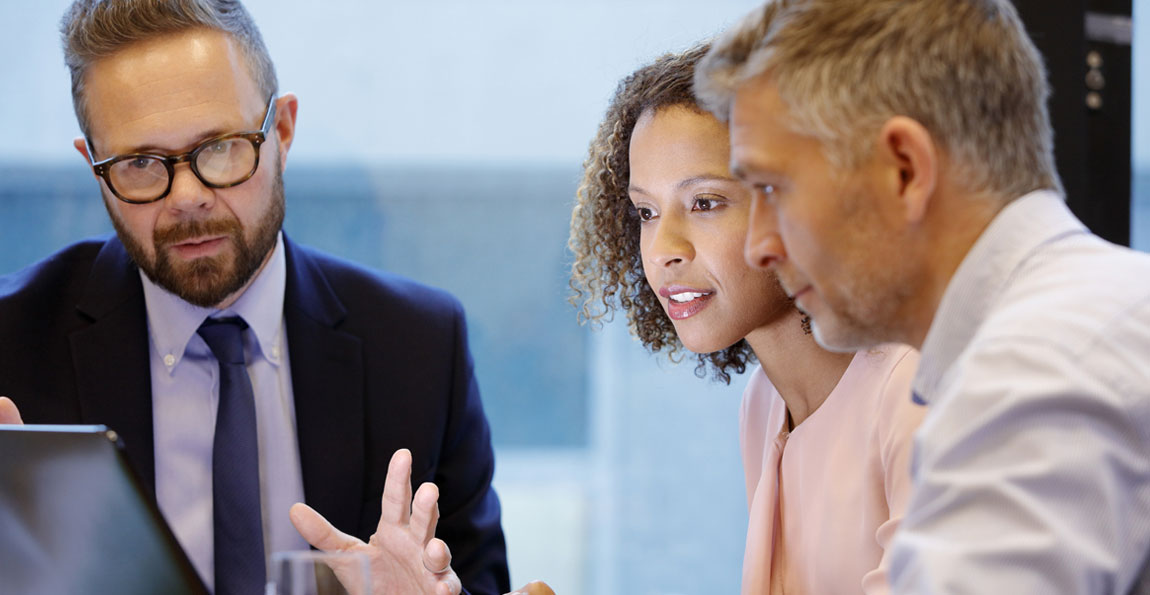 Business owners discussing financing with their small business banker