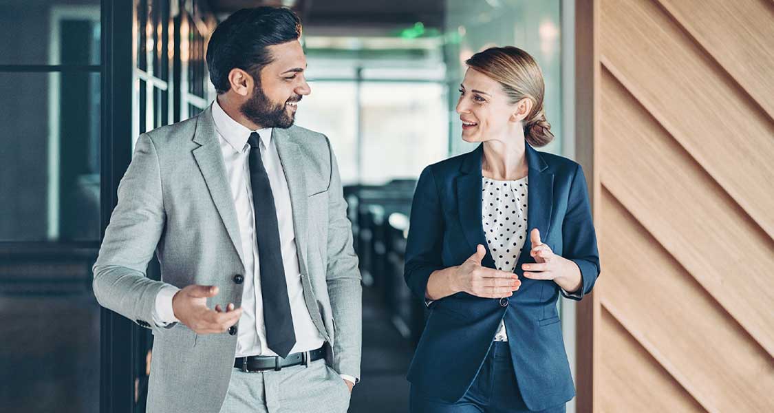 A business banking professional speaking with a client