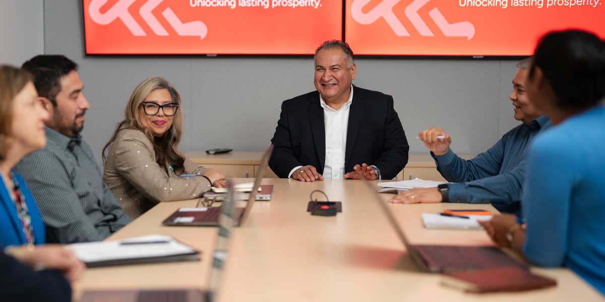 A business team sitting at a table during a meeting