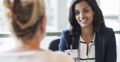 Female healthcare provider speaking to a female patient