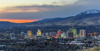 photo of a town surrounded by trees during sunset