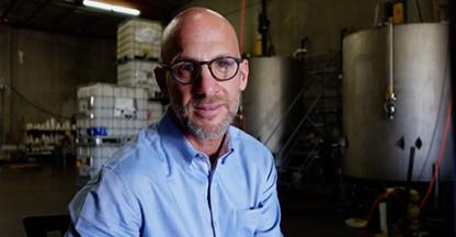 Bradley Zall, Founder and President of Accurate Companies, posing for the camera in a warehouse