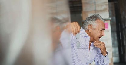 Man pondering something in a warehouse