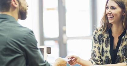 Woman talking to man in a bank