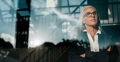 Businesswoman looking out of office window