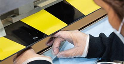 Close up of a worker on the assembly line.