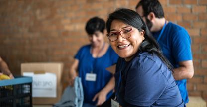 Smiling volunteers working at a nonprofit.