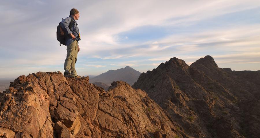 Man standing on mountain top