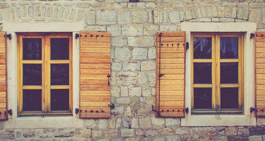 Exterior view of a brick home's windows