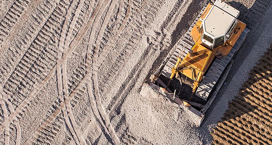 Bulldozer leveling ground