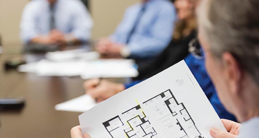 Man looking at a floorplan