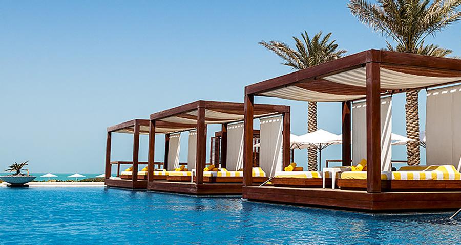 View of empty cabanas at a pool