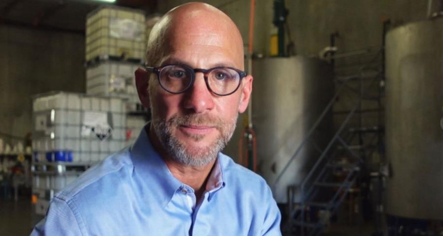 Bradley Zall, Founder and President of Accurate Companies, posing for the camera in a warehouse