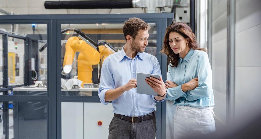 Two coworkers looking at paperwork together