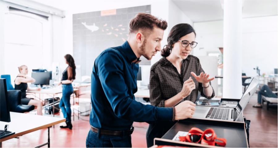 Two colleagues working at a computer