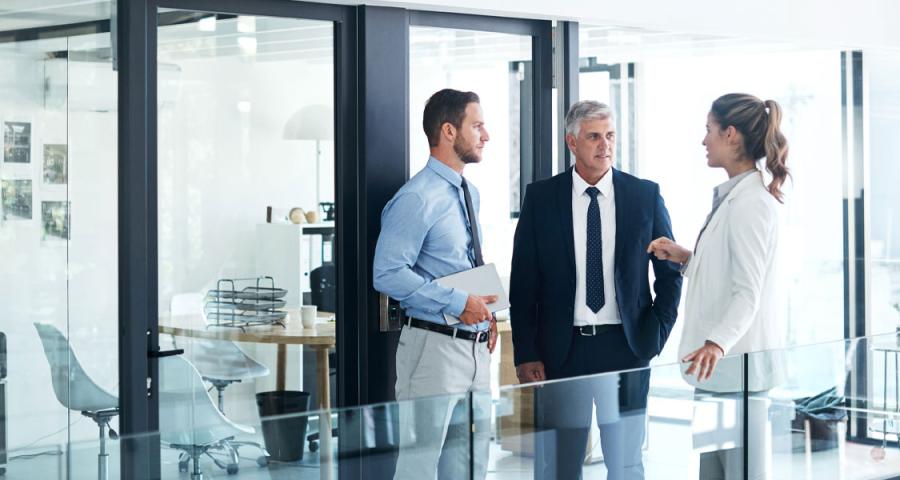 Sponsor finance professionals listening to a client from a private equity firm