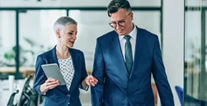 Business man and business woman talking in an office