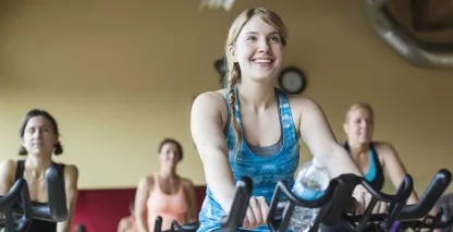 A woman enjoying her spin class