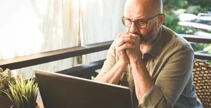A bank customer reading about wire fraud