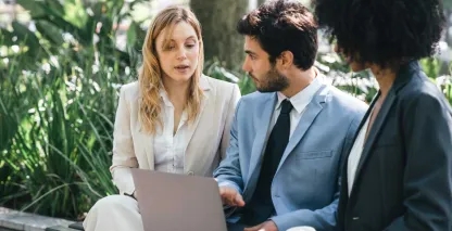 Two bankers discussing international wire transfers