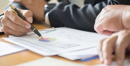 Two business people reviewing financial information