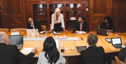 A group of attorneys meeting in a board room