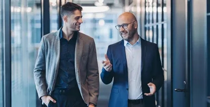 Two business men walking and talking