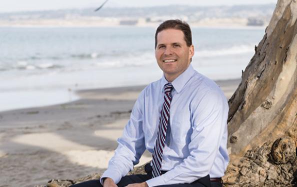 Jimmy Forbis, Finance Director, City of Monterey posing on the beach
