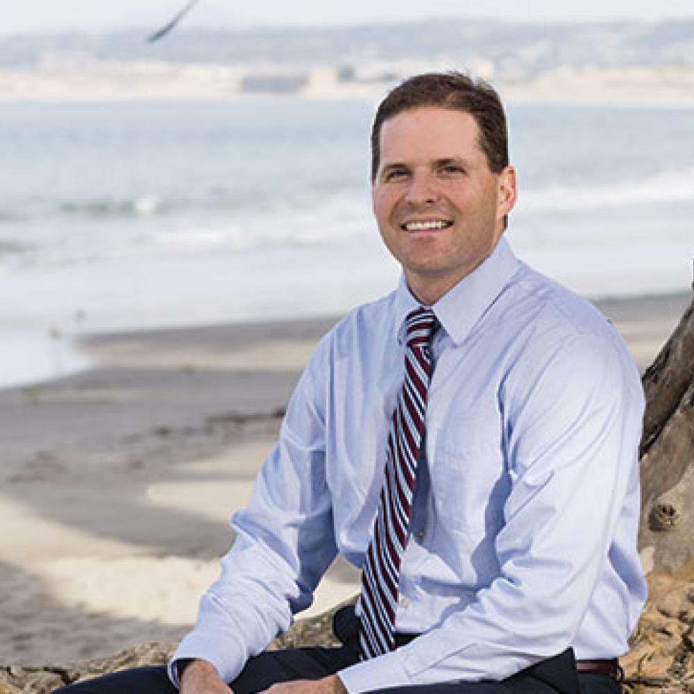 Jimmy Forbis, Finance Director, City of Monterey posing on the beach